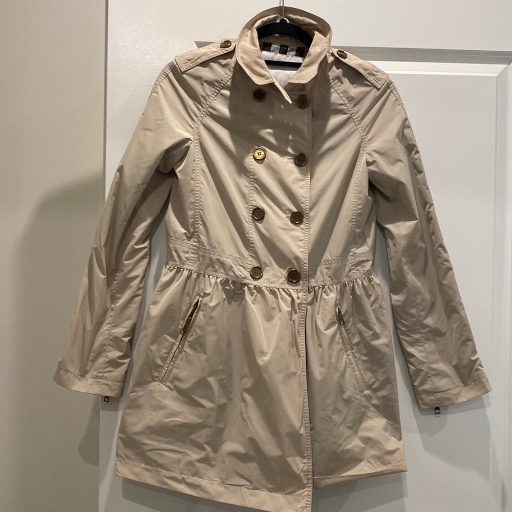 Burberry tan raincoat.